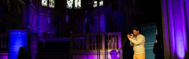 Speaker inside a church at a microphone