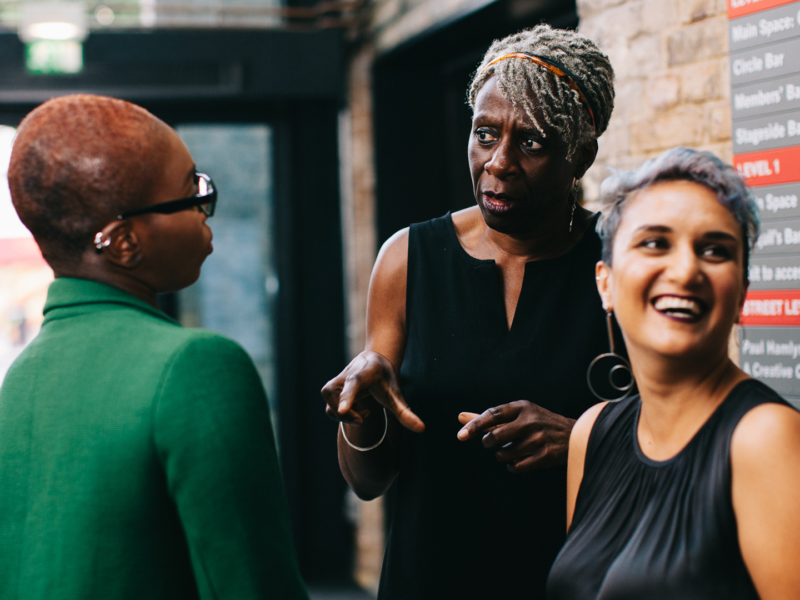 Farah laughing with participants of the CG Awards