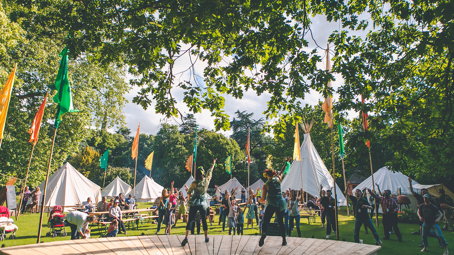 tents and flags on grassland