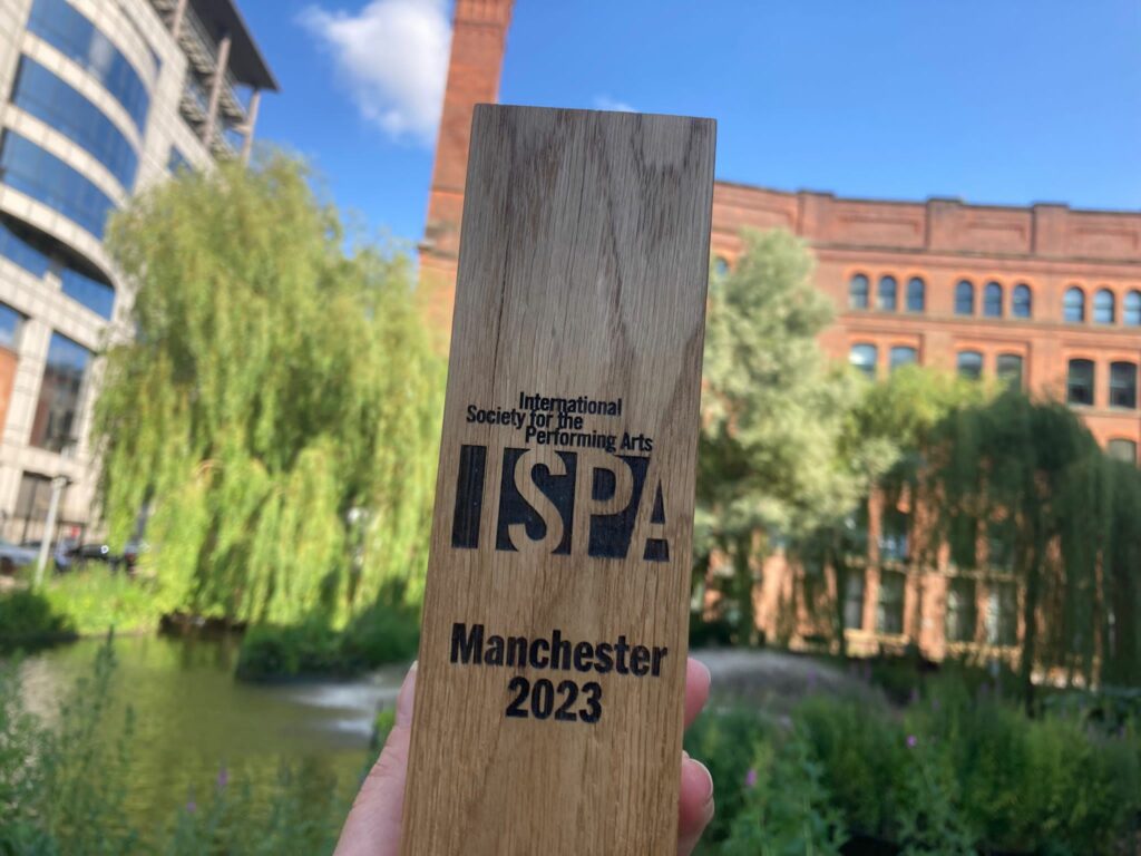A wooden award with ISPA written on it