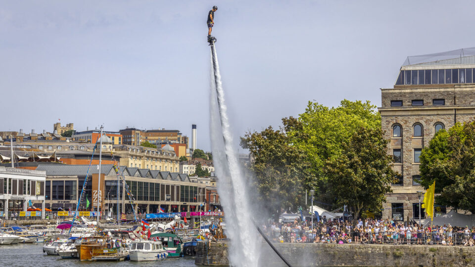 Person zooming up into the sky through the power of water