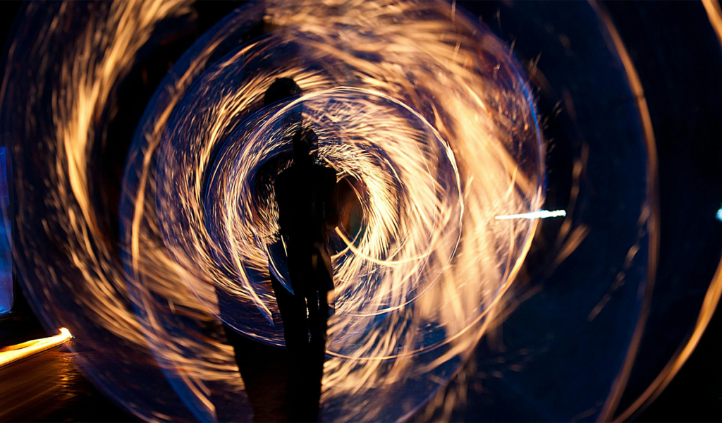 Silhouette of Person Holding Sparkler