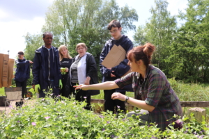 Sandwell College Foundation Learning students listening to Jane from TWT during the Tools Use training week at the Centre of the Earth