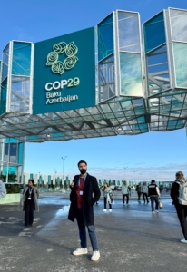 Jazib infront of COP29 sign