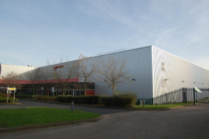 Outdoor shot of Birming Museums, angular shot with blue sky and some green grass