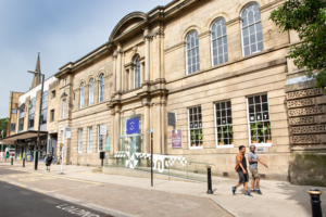 The Met, picture of front of building with blue sky above