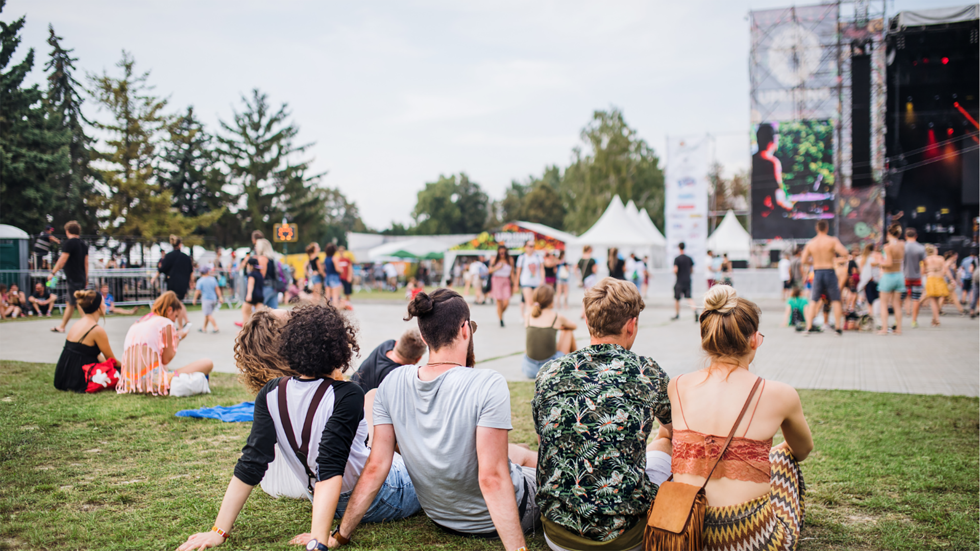 people outdoors watching live event